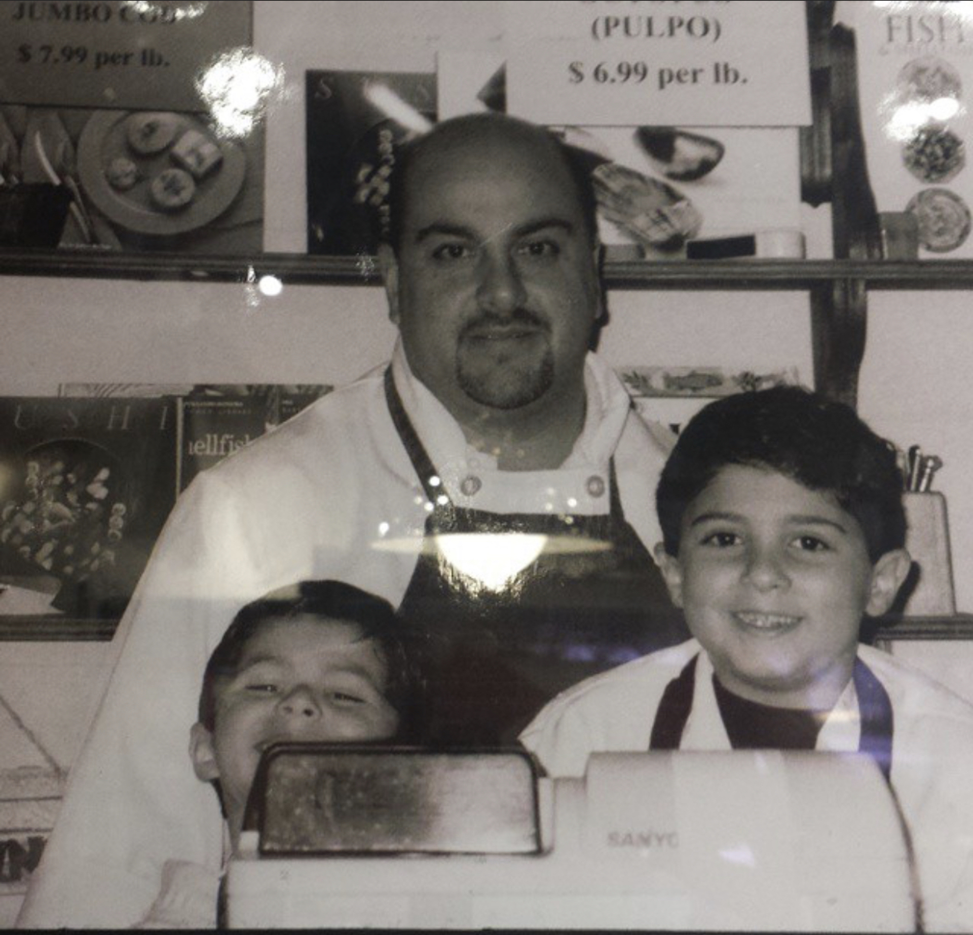 Old family photo of John Tramontano and kids at Fish tales Gourmet Seafood Market